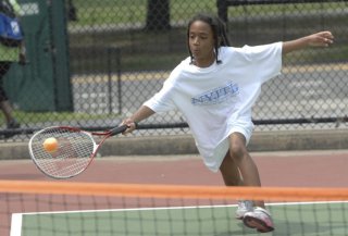kiddies practice within playing tennis camp in Crotona Park.